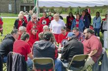 People are pictured gathered around the drum circle at the Grand Traverse Band of Ottawa and Chippewa Indians’ third annual Missing and Murdered Indigenous People (MMIP) Day of Awareness event last Friday in Traverse City. Enterprise photos by Meakalia Previch-Liu