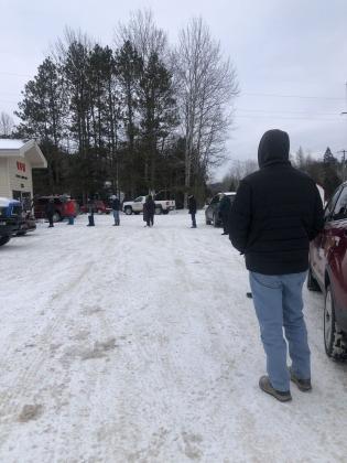 People seeking COVID testing line up in front of VFW hall in Lake Leelanau. At one point there was as many as 20 people in line.