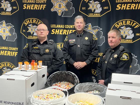 April 26 was National Drug Takeback Day, and the Leelanau County Sheriff’s Office marked the occasion with an event in collaboration with Catholic Human Services, Up North Prevention, and the Leelanau County Substance Misuse Prevention Coalition. Here, sheriff’s office personnel pose with the 1.6 million pills deposited in a collection box in their lobby since 2013. From left: Lieutenant Todd Roush, Sheriff Mike Borkovich, and Undersheriff James Kiessel. Courtesy photo