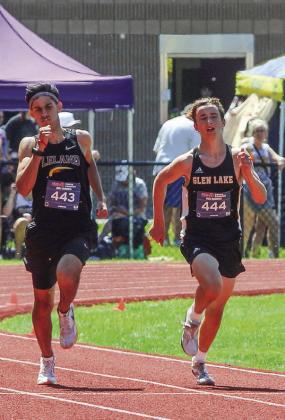 Leland senior Agustin Creamer and Glen Lake freshman Abraham Feeney battle for second place during the two-mile run. Both qualified for the state track meet.